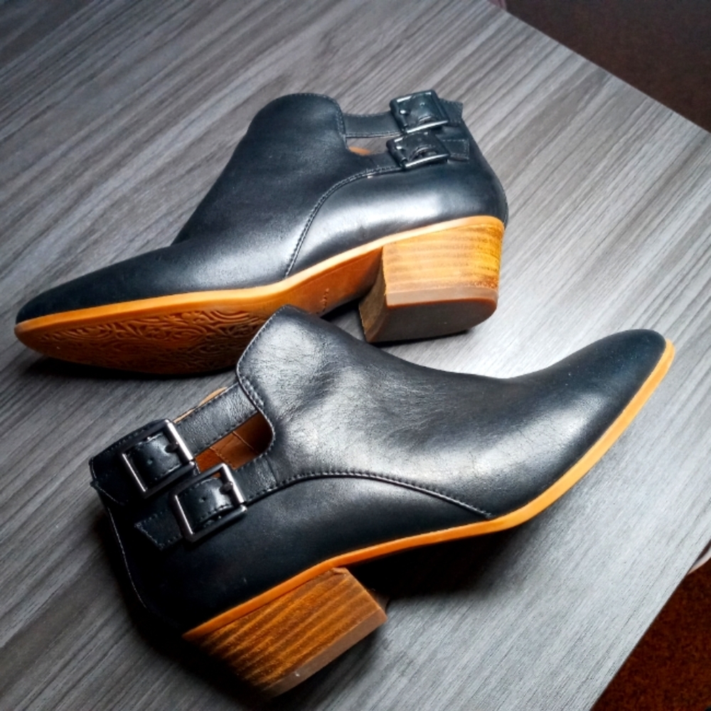 Buckled black booties
